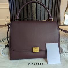 Beautiful Authentic Celine Trapeze Bag In The Medium Size, Featuring A Rich Burgundy Smooth Leather And Deep Blue Suede Leather Accents. This Bag Is From The Fall/Winter 2015 Collection By Phoebe Philo Excellent/ Like New Condition Includes Original Celine Dust Bag And Authenticity Card Colorblock Pattern - Burgundy And Deep Blue Buttery Soft Lambskin Interior Gold-Tone Hardware Suede Trim Rolled Handle & Single Shoulder Strap Dual Interior Pockets Includes: Celine Dust Bag, Shoulder Strap, Auth Luxury Purple Shoulder Bag For Office, Classic Purple Bag With Detachable Handle, Classic Purple Bag With Top Carry Handle, Classic Purple Top Handle Bag, Elegant Purple Office Satchel, Purple Office Shoulder Bag With Top Carry Handle, Designer Purple Top Handle Satchel, Purple Office Bag With Detachable Handle, Purple Top Handle Shoulder Bag For Office