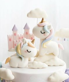 there is a cake that has two unicorns on it