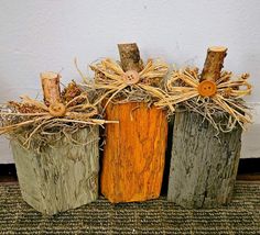 three wooden blocks are decorated with twine and burlock for fall decorating