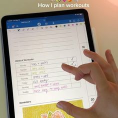 a hand is pointing at a workbook on an ipad