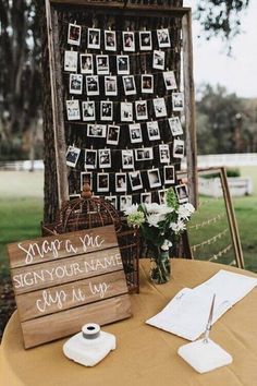 a wooden sign sitting on top of a table