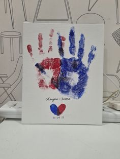 a handprint with the colors of france and red, white, and blue on it