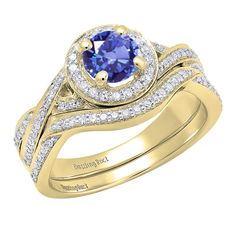 a yellow gold engagement ring set with an oval blue sapphire surrounded by round brilliant cut diamonds