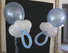 two balloons are attached to the side of a door