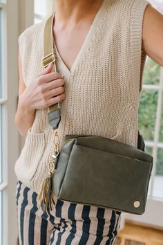 Crafted from luxe vegan leather and complete with glossy gold hardware, the Kinley Crossbody is the epitome of elevating your everyday. This spacious bag features special touches that you'll wonder how you ever lived without, like built-in card slots (eliminating the need for a bulky wallet), an adjustable strap (multi-wear options!), and pockets galore (allll the organization). Effortlessly chic and endlessly versatile, the occasions you'll wear this bag for are as infinite as the reasons you'l Platform Flats, Flying Monkey Jeans, Black Camel, Chic Bags, Judy Blue Jeans, Crossbody Wallet, Modern Chic, Glasses Accessories, Cocktail Dress Party