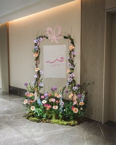 a photo frame with flowers on the floor