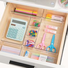 an organized drawer with various office supplies