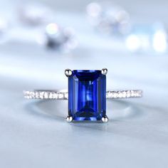 You are looking at a vintage Lab-Created Blue Sapphire Engagement Ring. A perfect anniversary gift, birthday gift,wedding engagement ring.Great as a gift for her.Ring Information<><><><><><><><><><><><><><><>Main Stone*Lab-Created Blue Sapphire*6x8mm blue sapphire*Weight:it's approx 1.5 ctw.*Setting:4-prongStone On the Band*SI Clarity and H Color real diamond.Metal* Solid 10k 14k &18k.*Color:white gold,yellow gold,rose gold.Custom Order<><><><><><><><><><><><><><><>*The main stone can be other g Emerald Cut Gia Certified Sapphire Ring For Anniversary, Elegant Blue Birthstone Ring For Anniversary, Fine Jewelry With Lab-created Sapphire For Gift, Blue Emerald Classic Promise Ring, Radiant Cut Sapphire Jewelry For Anniversary, Classic Blue Emerald Cut Ring, Classic Blue Emerald Ring With Prong Setting, Anniversary Emerald Ring With Sapphire Accent Stones, Rectangular Sapphire Anniversary Ring