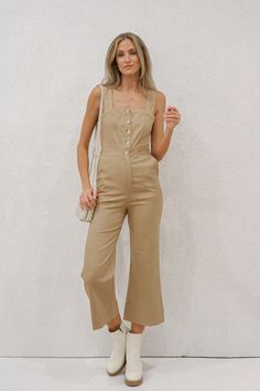 Cropped khaki jumpsuit. Held by tank top straps and a square neckline. Button front closure. Material: 100% Rayon. Sizing: Small: US Size 0-2 Medium: US Size 4-6 Large: US Size 8-10 Model Measurements: Height: 5’11” Chest: 32” Waist: 26” Hips: 36” Wearing size small. This item is FINAL SALE. Khaki Jumpsuit, Top Straps, Tank Top Straps, Square Necklines, Square Neckline, Model Measurements, Final Sale, Outfit Inspirations, Jumpsuit