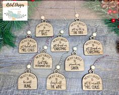 six wooden ornaments with christmas sayings on them