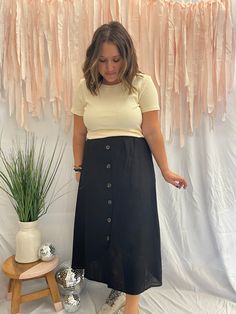 Product Description: We fell in love with this beautiful and easy to style linen blend midi skirt and we know you will too! Whether you dress this up with boots and a blouse or down with sneakers and a basic top you can't go wrong with adding this one to your cart. Quick Product Details and Features: Midi or Maxi Length (depending on height) Breathable Linen Blend Decorative Button-Down Closure Material: 45% Cotton, 30% Linen, 25% Viscose Color: Black Product Fit: Fits true to size. Quick Model Aline Midi Skirt, Church Outfit Ideas, Denim For Women, Bottoms For Women, Midi Skirt Outfit, Skirt With Buttons, Casual Work Outfit, Casual Hairstyles, Skirt Fits