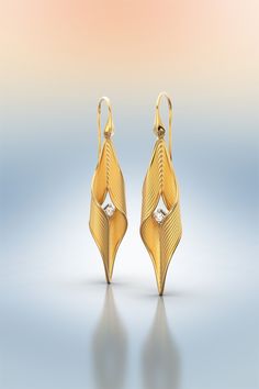 Long twisted diamond earrings made in Italy in 14k or 18k pure yellow gold hallmarked. The earrings are crafted in polished and raw gold 18k or 14k. Diamonds 0,15 Cts tw. Modern symmetric gold earrings with natural diamonds. Stone Type: 100% Natural Diamonds Shape: Round Brilliant Carat Weight: approx. 0,15 Cts TW Color: G Clarity: VS Cut: Very Good Customizable Materials: 14k solid yellow gold, white gold, rose gold 18k solid yellow gold, white gold, rose gold ❥ Production time for custom desig Arabesque Jewelry, Chunky Gold Earrings, Raw Gold, Italian Gold Jewelry, Rose Gold Drop Earrings, Gold Statement Earrings, Solid Gold Earrings, Italian Jewelry, Gold Diamond Earrings