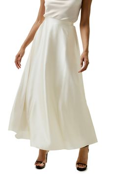 This exquisite 100% silk flowy maxi skirt is a testament to refined style and elegance. The sway of the fabric is mesmerizing, gracefully moving with your every step. The fluid sheen of the silk reflects light in a delicate, captivating manner. 100% silk Flowy maxi skirt Sway to mesmerize White skirt offers extra inner layer Fluid Sheen Maxi Silk Skirt, Flowy Maxi Skirt, Tailored Fashion, White Elegance, Silk Bedding Set, Silk Nightwear, Silk Clothes, Flowy Maxi Skirts, Striped Midi Skirt