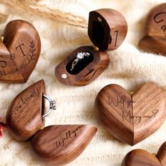 wedding rings and wooden hearts with names on them