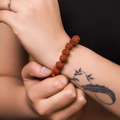 This elastic bracelet features a 5 face rudraksha bead, symbolizing the 5 elements, and handmade. A spiritual gift for yoga lovers, this Shiva-inspired bracelet emanates a unique and elegant energy, perfect for sophisticated tastes. Five mukhi rudraksha is a symbol of five forms of Lord Shiva, named as ‘RudraKalagni’. It helps the wearer to gain good health and peace. Rudraksha cultivates wisdom and intellect and helps to attain success in all walks of life. It brings positivity and serenity in 5 Mukhi Rudraksha, Rudraksha Bracelet, Rudraksha Beads, Indian Gifts, Ear Chain, Mens Fashion Wear, 5 Elements, Wrist Band, Fancy Jewelry