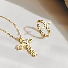 Embrace the spirit of devotion with our "Divine Harmony" set, featuring a ring and necklace that interlace the profound ichthys symbol with the sanctity of the cross. This pairing is a homage to steadfast faith and the continuity of spiritual grace.The ring, a slender circle of gold, boasts an ichthys motif merging into a cross design, symbolizing the unity and flow of divine love. It mirrors the necklace's centerpiece, where the same symbols entwine gracefully, a confluence of tradition and ele Eternal Faith, Fish Symbol, Gold Statement Ring, Divine Light, Divine Love, Cross Design, Original Card, Spiritual Life, Cross Designs