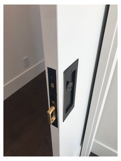 the door is open and there is a key in it that is on the side of the door