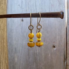 I have been seeing mustard yellow all over lately. I have had these beads tucked away, just waiting for inspiration. These earrings are dangling from pure titanium post ear wire. Perfect for those with sensitive ears. The Czech bead is a 6mm melon bead. It has a touch of black in various places on the bead. Very vintage feel to the beads. These earrings are a perfect match to the necklace that is also listed. You can find it here. https://www.etsy.com/listing/707647612/vintage-style-mustard-yell Hypoallergenic Gold Bohemian Beaded Earrings, Nickel Free Yellow Beaded Earrings For Gift, Nickel-free Yellow Beaded Earrings As Gift, Nickel-free Yellow Beaded Earrings For Gifts, Yellow Dangle Earrings With Ear Wire, Everyday Yellow Beaded Jewelry, Yellow Beaded Czech Glass Earrings, Yellow Beaded Earrings With Czech Glass, Yellow Beaded Earrings In Czech Glass