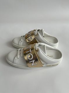 Louis Vuitton Women's Stellar Open Back White Leather Sneakers Sz 35  | eBay Luxury Leather Sneakers With White Sole, Lv White Sneakers, Luxury Leather Slip-on Sneakers With Removable Insole, White Leather Sneakers With Reflective Details, Louis Vuitton White Sneakers, White Leather Sneakers, Stay Active, Fashion Shop, High Quality Leather