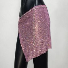 Rhinestone self-tie skirt. Size is adjustable. Can be worn by sizes XS, S, M, L, XL. Length-15” Waist-30”-46” Tie Skirt