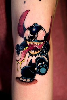 a cartoon character is depicted on the leg of a person with a tattoo that looks like an angry shark