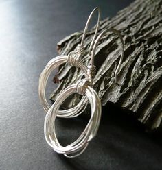 Modern Wire Wrapped Hoop Earrings For Gift, Modern Handmade Hoop Wrap Earrings, Modern Silver Wire Wrapped Hoop Earrings, Modern Sterling Silver Wire Wrapped Hoop Earrings, Minimalist Sterling Silver Wire Wrapped Earrings, May 7, Matching Necklaces, Handmade Necklaces, Modern Contemporary