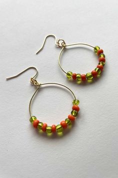 Made with gold plated posts and recycled beads, the Julia Earrings are not only fun, but also sustainable and great for those with sensitive ears. These lightweight hoops feature recycled orange and green beads. Recycled Beads, Green Beads, Orange And Green, Hand Made Jewelry, May 23, Green Bead, Sensitive Ears, Favorite Jewelry, Jewelry Earrings Dangle