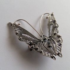 "Butterfly Brooch Mariposa Filigrana - Sterling Silver Brooch - Filigree Jewelry - Butterfly Jewelry - Filigree Brooch - Gift Idea for Her Mariposa means Butterfly in Spanish. Filigree - delicate jewellery technique made from silver or golden threads \"embroidering\" kind of metalwork lace that is specific to Spain, especially an Andalusian town Cordoba, where they call it a cordobese filigree. This craftsmanship has been passed from generation to generation, nonetheless nowadays there are very Jewelry Butterfly, Delicate Jewellery, Filigree Jewelry, Sterling Silver Brooch, Jewelry Techniques, Butterfly Jewelry, Butterfly Brooch, Delicate Jewelry, Silver Brooch