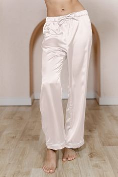 Getting ready the morning of your wedding just got cuter! Our Daybreak Satin Sleep Pants are available in White Pearl Satin for the Bride and all of our satin colors for your wedding party. These pants can be paired with our Daybreak Long Sleeve Shirt, our Sleepover Short Sleeve Shirt, or even our Dolled Up Tanktop. Have your crew be cohesive or have them mix and match with their choosing! For the bride-to-be, you can choose the White Pearl Satin option with a classic White Pearl piping edge or Elegant Straight Leg Wedding Bottoms, White Satin Bottoms For Wedding, White Satin Wedding Bottoms, Elegant Wide Leg Bottoms For Pajama Party, Elegant Long Pants For Wedding, Satin Colors, Wedding Parties Colors, Bridesmaid Dress Colors, Sleep Pants