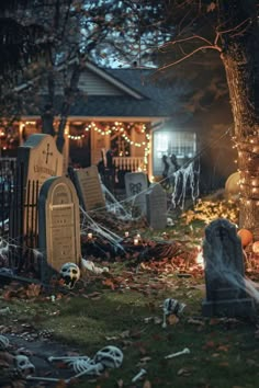 a cemetery with halloween decorations and lights in the background