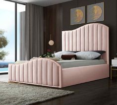 a pink bed sitting in a bedroom on top of a hard wood floor next to a window