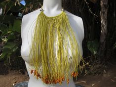 Bohemian Hippie Cotton Beaded Fringe Choker Multi Strand Bib Festival Necklace.The necklace is made of multi strands of yellow cotton, some end with beads, some without.The fall of the necklace is Approx. 18" long.Thanks for Looking!! Yellow Beaded Necklaces With Large Beads For Summer, Summer Yellow Beaded Necklaces With Large Beads, Adjustable Yellow Multi-strand Beaded Necklace, Yellow Handwoven Beaded Necklaces, Yellow Beach Necklaces With Wooden Beads, Yellow Necklaces With Wooden Beads For The Beach, Yellow Wooden Beaded Necklaces For Beach, Yellow Wooden Beads Necklace For Beach, Bohemian Yellow Necklaces For The Beach