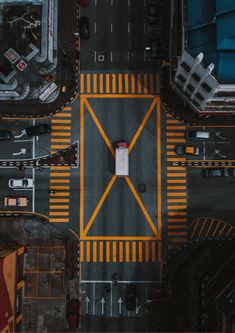 an overhead view of a street with yellow lines