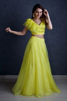 Lemon green organza lehenga. Paired with a pleated, padded and ruffle panel blouse with dupatta. - Aza Fashions Evening Ruffled Dress For Diwali, Sleeveless Ruffled Lehenga For Party, Fitted Sleeveless Organza Pre-draped Saree, Fitted Sleeveless Organza Set, Sleeveless Ruffled Set For Reception, Sleeveless Ruffled Reception Set, Festive Sleeveless Lehenga With Ruffles, Sleeveless Ruffled Lehenga For Festive Occasions, Festive Sleeveless Ruffled Lehenga