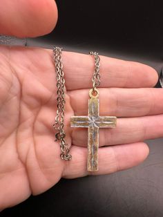 Very lightweight metal. Great cross!  Simple and elegant.  Minor wear on finish. Nickel-free Metal Cross Jewelry, Spiritual Cross Jewelry In Metal, Metal Cross Pendant Necklace, Gold Metal Cross Jewelry, Gold Cross-shaped Metal Jewelry, Spiritual Metal Cross Necklace, Formal Cross-shaped Metal Jewelry, Gold Metal Crucifix Cross Necklace, Nickel-free Gold Cross Necklace