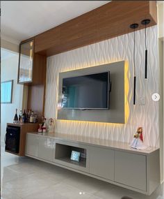 a flat screen tv mounted to the side of a wall