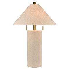 a table lamp with a white shade on it and a gold metal pole in the middle