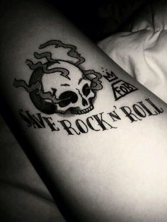 a person with a tattoo on their arm that says, we rock'n roll