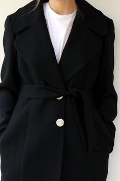 Absolutely gorgeous vintage 90s Dolce & Gabbana wool coat in black Super classy, three round front silver buttons and three on each arm sleeve marked D&G, side pockets, belt attached, fully Lined in black satin. aside from minor signs of wear Excellent vintage condition.Marked D&G Made in Italy.** Model is 5'7" and size S **  / bust: 33" / waist: 26" / hips: 37"Tag size: 46Approximate size S/M please refer to the MeasurementsMeasurements: taken while lying flat, double where necessar Elegant Wool Coat With Buttons, Black Wool Coat With Button Cuffs For Formal Occasions, Formal Black Wool Coat With Button Cuffs, Elegant Wool Coat For Work With Buttons, Elegant Wool Coat With Lapel Collar And Buttons, Elegant Formal Wool Coat With Buttons, Elegant Black Wool Coat For Work, Elegant Long Sleeve Wool Coat With Buttons, Elegant Black Single-breasted Wool Coat