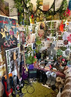 a room filled with lots of guitars and posters