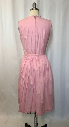 "Unworn without tags. Sleeveless pint with lace and pleated tuxedo front detailing. Back of belt reads Leslie Washable Tagged size 11. In as found condition - not laundered. Shown on size six dress form Measurements Bust: 35\" Waist: 26\" Hip: Open Back of neck to waist: 15\" Will ship internationally - please convo for pricing. PLEASE convo me if you have any further questions about this item or would like to see more pictures. I do my best to research items thoroughly before listing as well as Spring Sleeveless Dress With Box Pleat, Sleeveless Dresses With Fitted Waist For Daywear, Classic Pleated Sleeveless Dress For Spring, Classic Fitted Pleated Sleeveless Dress, Classic Fitted Sleeveless Pleated Dress, Formal Sleeveless Dress With Box Pleat, Sleeveless Summer Dresses With Pintucks, Pink Fitted Pleated Sleeveless Dress, Sleeveless Cotton Belted Dress