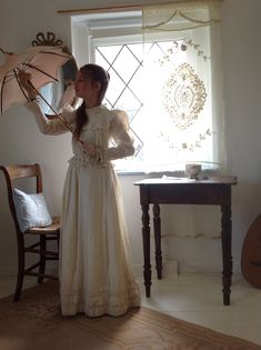 "1900s antique calico print dress in soft yellow color on a light old white/ beige background. the bodice is cotton linen and has lace at the front and along the bracelets the front has a little wound, but is mended. bust 72 cm waist 66 cm 26\" the skirt has waist 60 cm 23.5\" length from waist to bottom: 93 cm the skirt has several mendings as to be seen in the pictures one little hole is still waiting for repair.. the bottom line is a bit soiled" Vintage White Victorian Dress With Lace Collar, Vintage Victorian Dress In Beige For Spring, Vintage Beige Victorian Dress For Spring, Vintage Cream Dress With Lace Collar, Vintage Beige Prairie Dress With Lace Trim, Vintage White Victorian Dress With Lace Trim, Victorian Cream Vintage Dress With Lace Trim, Cream Victorian Vintage Dress With Lace Trim, Fitted Vintage Cream Prairie Dress