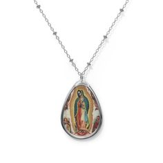 Add a custom touch to what you're wearing with this necklace showing the beautiful painting of Our Lady of Guadalupe painted by Miguel Cabrera in 1750 The pendant and its chain are made with robust brass material for dazzling looks that are long-lasting. The print panel is made with aluminum while the pendant itself comes in a unique shape of an ellipse. .: Brass pendant and necklace chain .: Ellipse-shaped pendant .: White aluminum print surface .: Lobster clasp closure Spiritual Oval Our Lady Of Guadalupe Necklace, Spiritual Oval Necklace Featuring Our Lady Of Guadalupe, Oval Our Lady Of Guadalupe Jewelry Gift, Silver Our Lady Of Guadalupe Necklace, Oval Our Lady Of Guadalupe Necklace Gift, Oval Our Lady Of Guadalupe Necklace For Gift, Spiritual Our Lady Of Guadalupe Jewelry Gift, Catholic Confirmation, Virgin Of Guadalupe