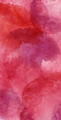 an abstract watercolor painting with red and pink colors on it's paper background