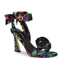 Nine West-Krave Sandal Look like a work of art in this gorgeous Nine West Krave sandal. A flower embellishment on the upper sits beautifully, making you fashionably intimidating wherever you go. The tie closure makes it even exciting and the tapered heel ties everything together. Tie Up Sandals, Sneaker Dress Shoes, Under Dress, Dress Sandals, Shoe Size Chart, Rose Design, Womens Uggs, Black Sandals, Shoe Brands