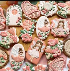 cookies decorated with fairy images and flowers