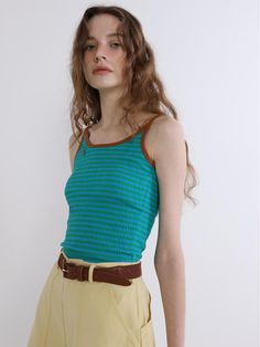 This is a modern and comfortable top by GREENBUTTER that is made out of high quality and sturdy fabric. With unique design detail and trendy mood, you can style it for your casual and young daily outfit.- Tentar and tumble washed fabric- Deep back neckline- Wrinkle processed fabric- Double inner chest line Trendy Green Tank Top, Trendy Green Sleeveless Tank Top, Casual Green Stretch Tank Top, Casual Green Sleeveless Top, Casual Green Vest Top, Green Cotton Tank Top, Green Vest Top For Spring, Trendy Vest Tops For Layering, Green Tops For Everyday Summer Wear