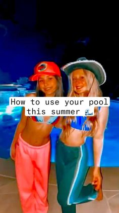 two girls standing next to each other in front of a pool