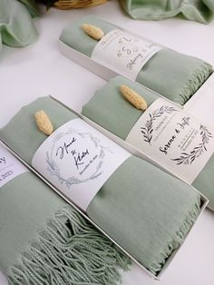 the table is set with napkins and place cards for guests to sign on them