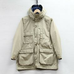 Vintage Woolrich Light Jacket Womens Size Medium Beige Hooded Condition/Description Good condition. Stains found around; see pictures. Loose stitching found on inner lining. Size tag is missing; refer to measurements.  Measurements Size Estimated - Womens Medium Pit to pit - 21.5" Length - 29" Sleeve collar to cuff - 27" SIZE IN TITLE IS AN ESTIMATE ACCORDING TO MEASUREMENTS CONDITION LEGEND ***Please note that items are vintage and will have "regular wear" such as fading or wear to the print/em Vintage Woolrich, Beige Jacket, Spring Jacket, Long Jacket, Womens Jackets, Light Jacket, Short Pants, Size Tag, Military Jacket